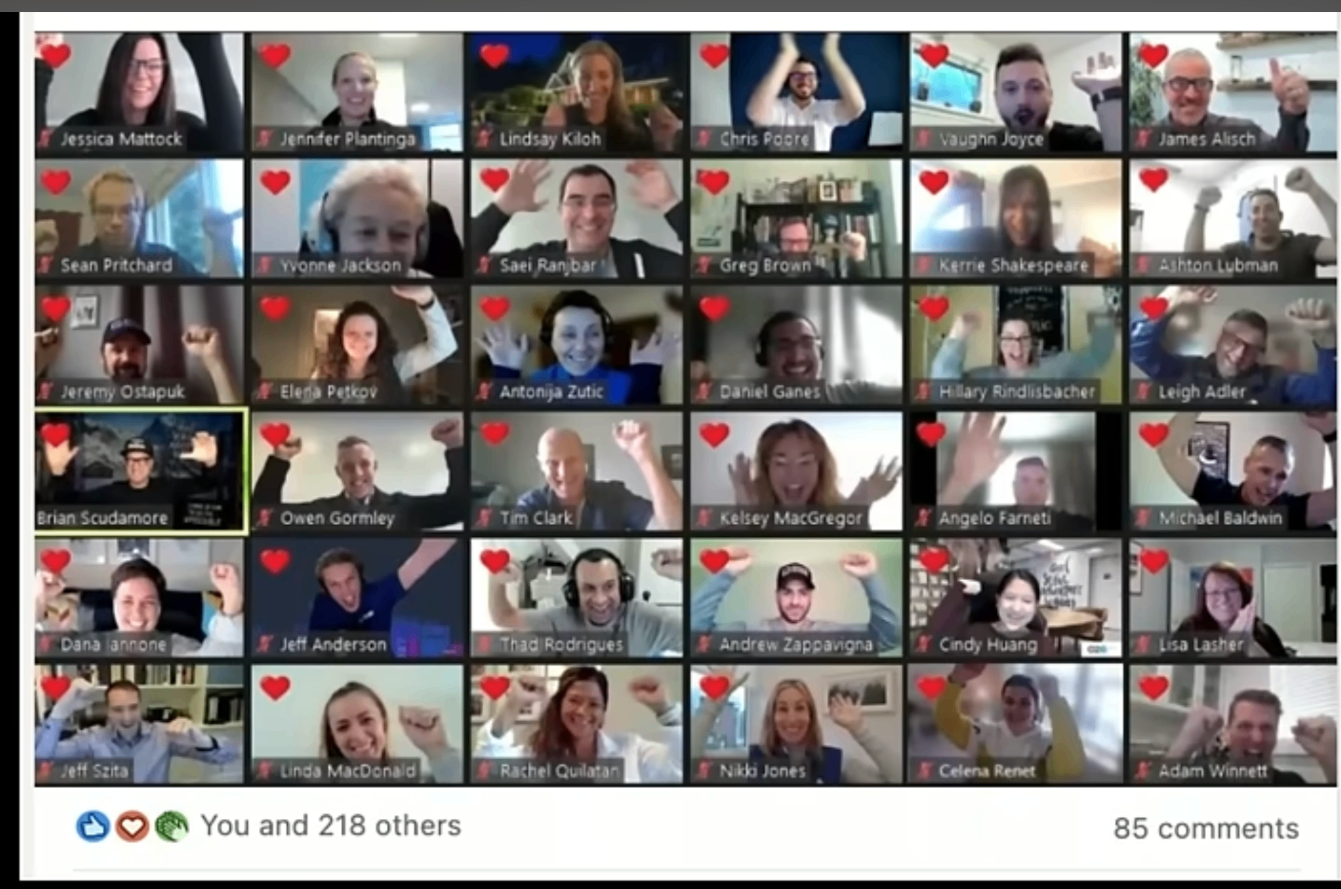 All-hands video call grid with hearts overlaying every employee tile